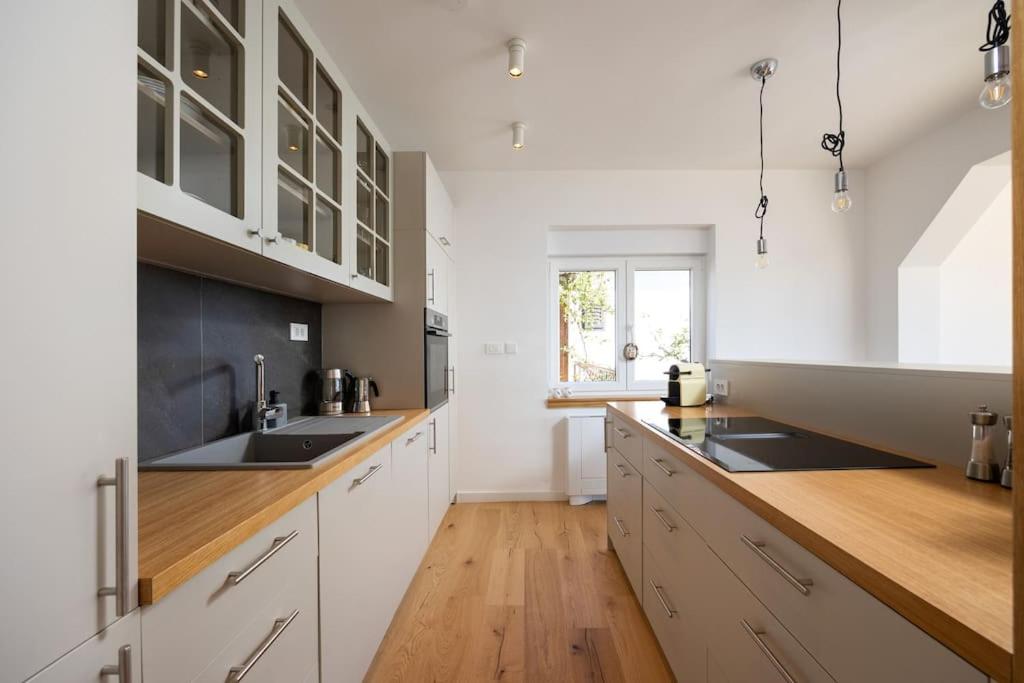 Kitchen with window and pendant lights