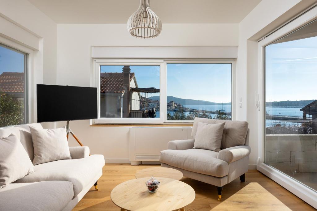Bright living room with wide windows overlooking the bay