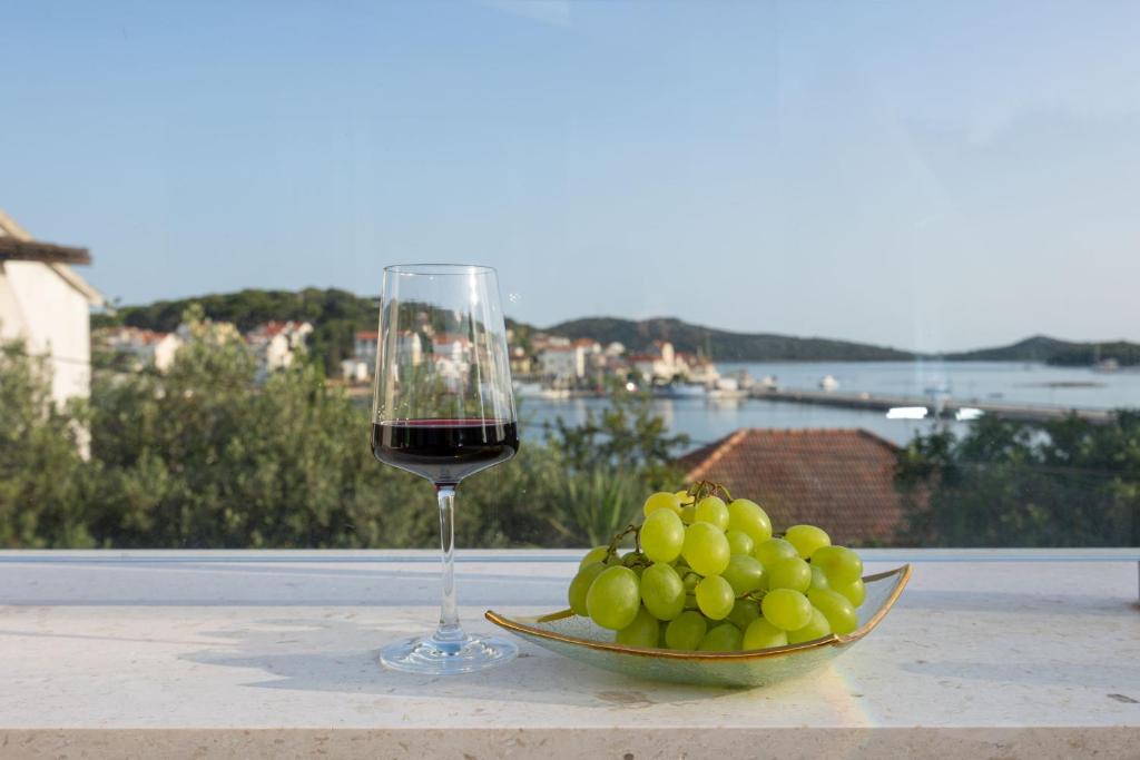 Wine and grapes overlooking the bay