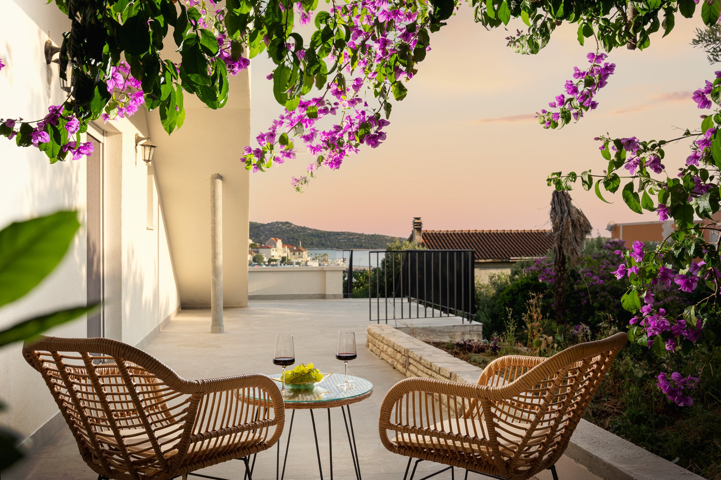 Private garden terrace of the studio with sea view under the bougainvillea