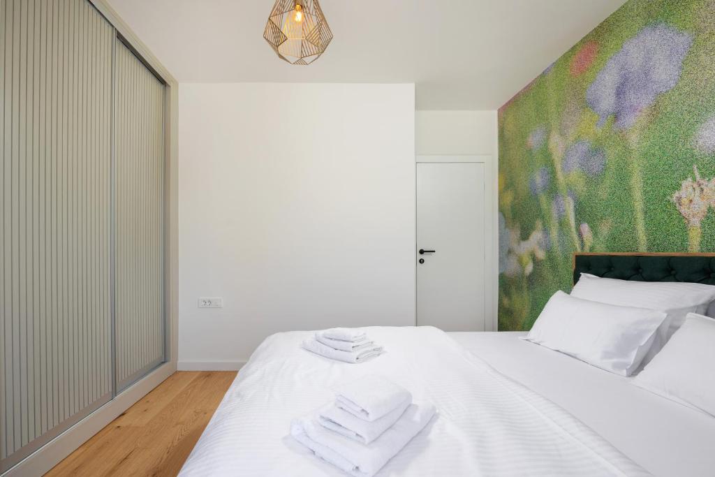 Bedroom with flower mural and wardrobe