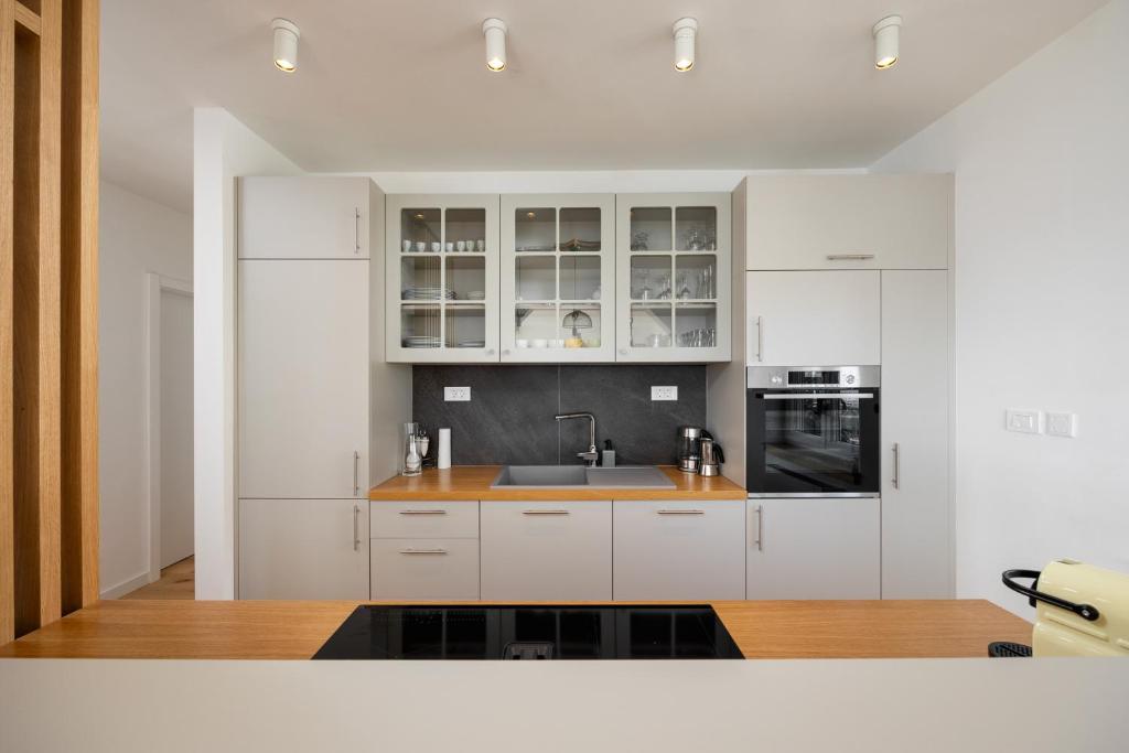 Kitchen with glass cabinets and oven